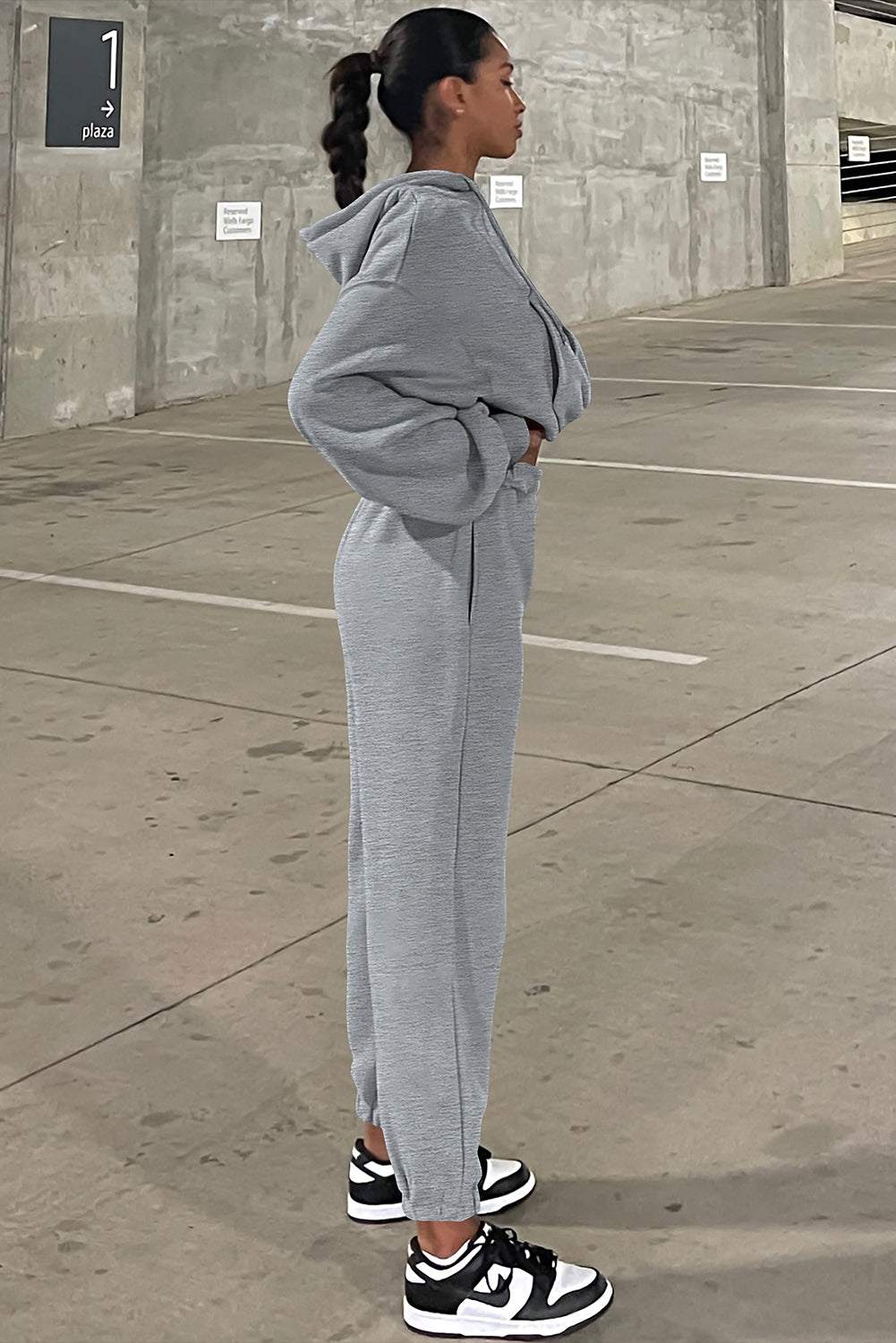 Right Side angle view of gray drop shoulder hoodie and jogger pants set