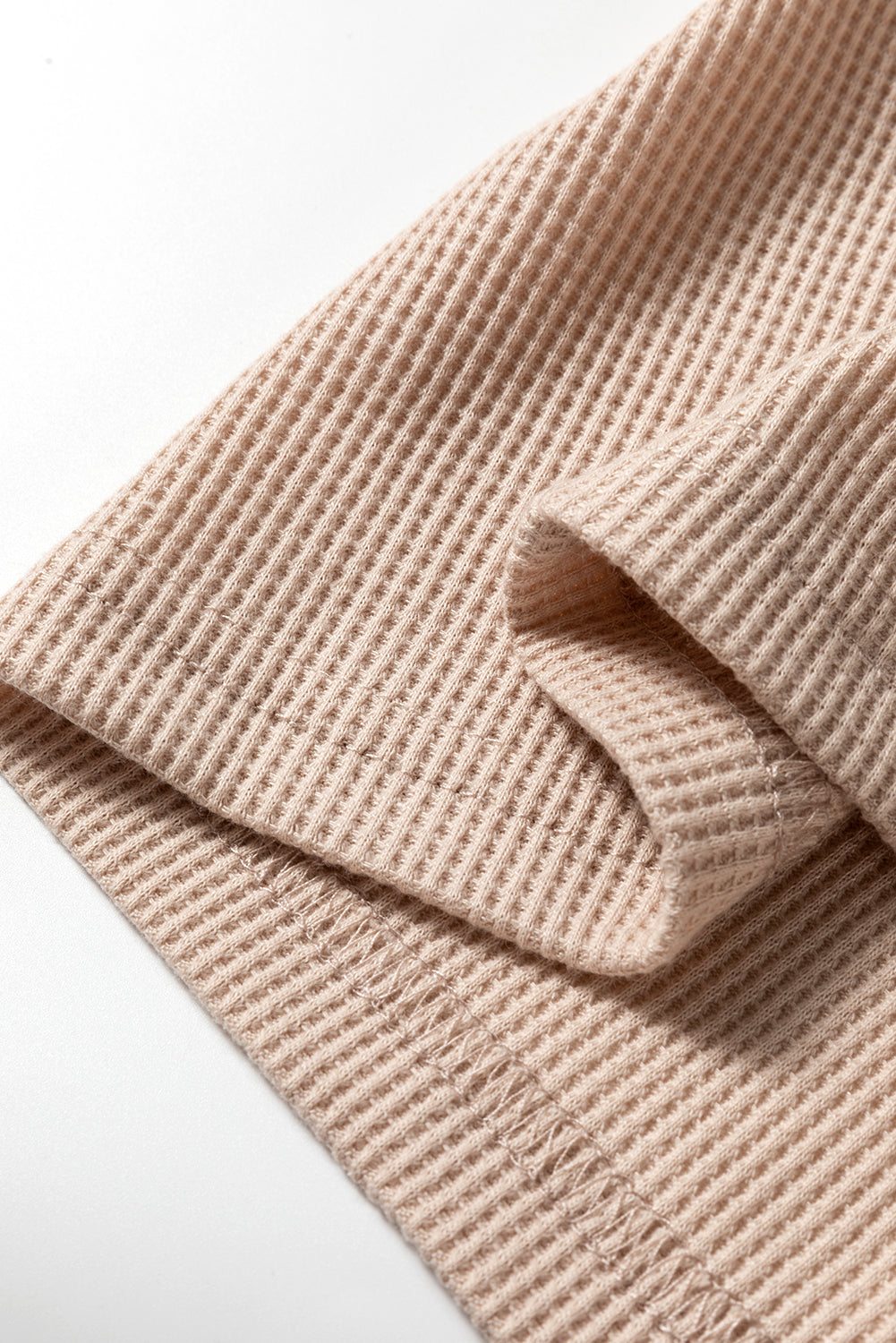 Close-up of beige Parchment Textured Lounge Sett showing soft waffle knit pattern and stitching detail