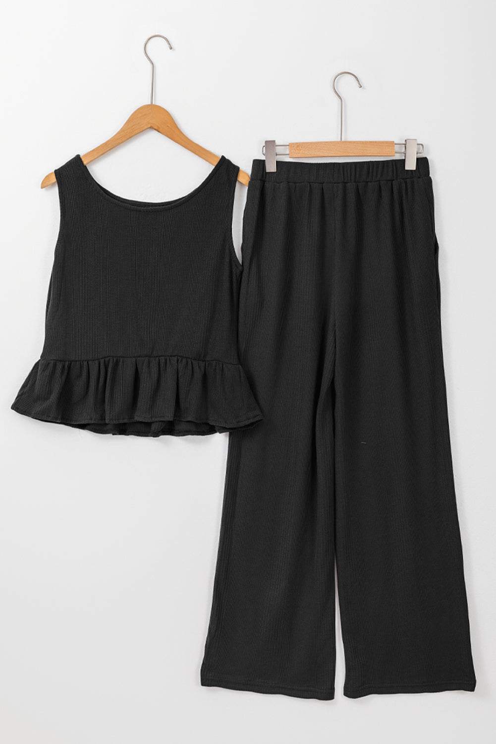 black ribbed ruffle tank top and pants set on hangers