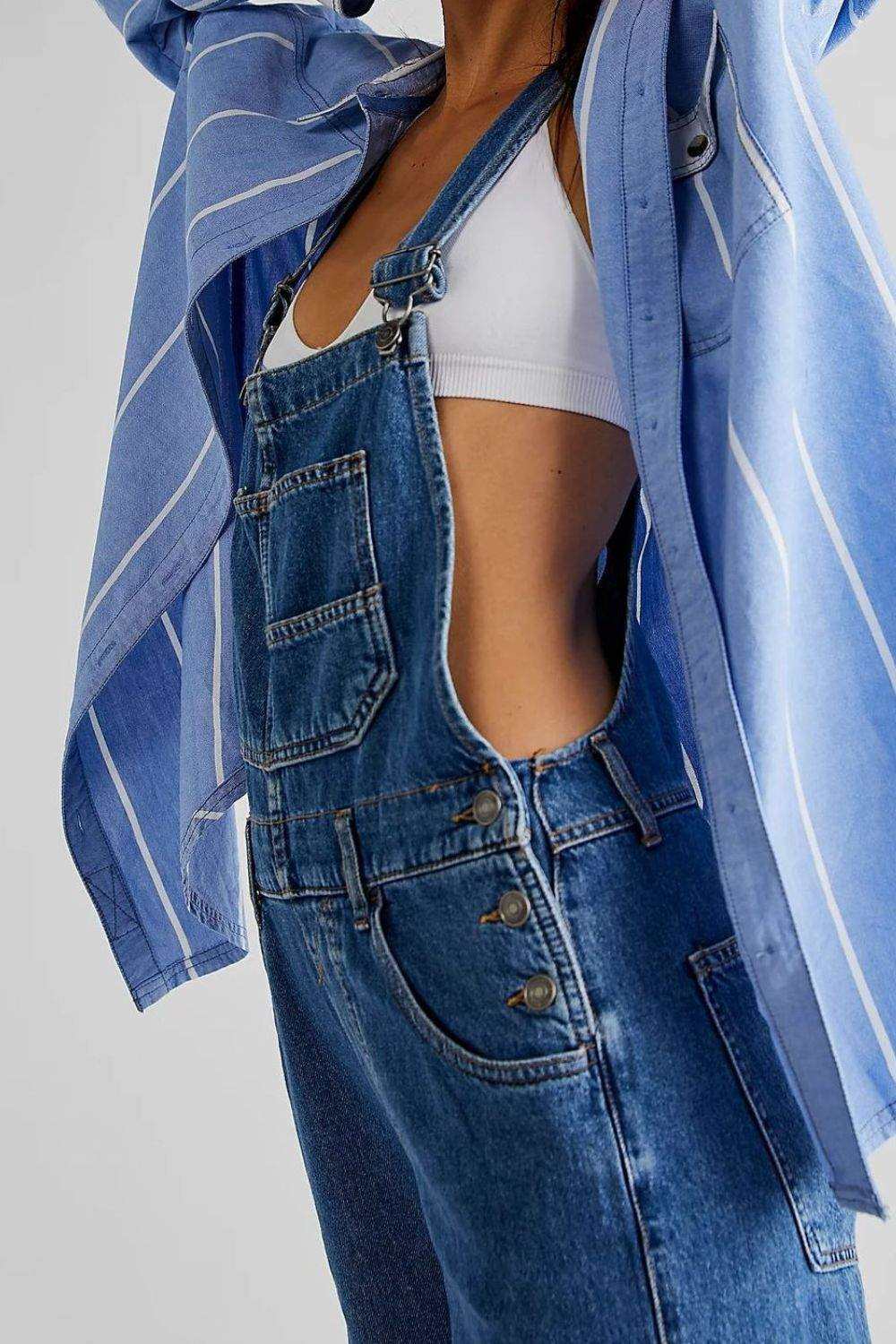 Wide strap square neck denim overalls with adjustable straps and pockets.