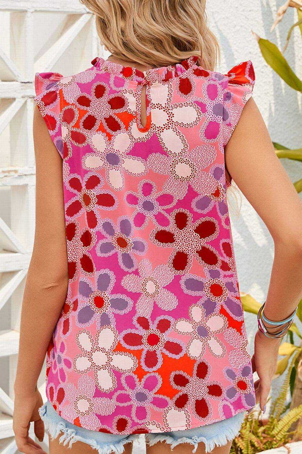 Floral Ruffled Cap Sleeve Blouse with Embroidered Detail in pink and red tones.