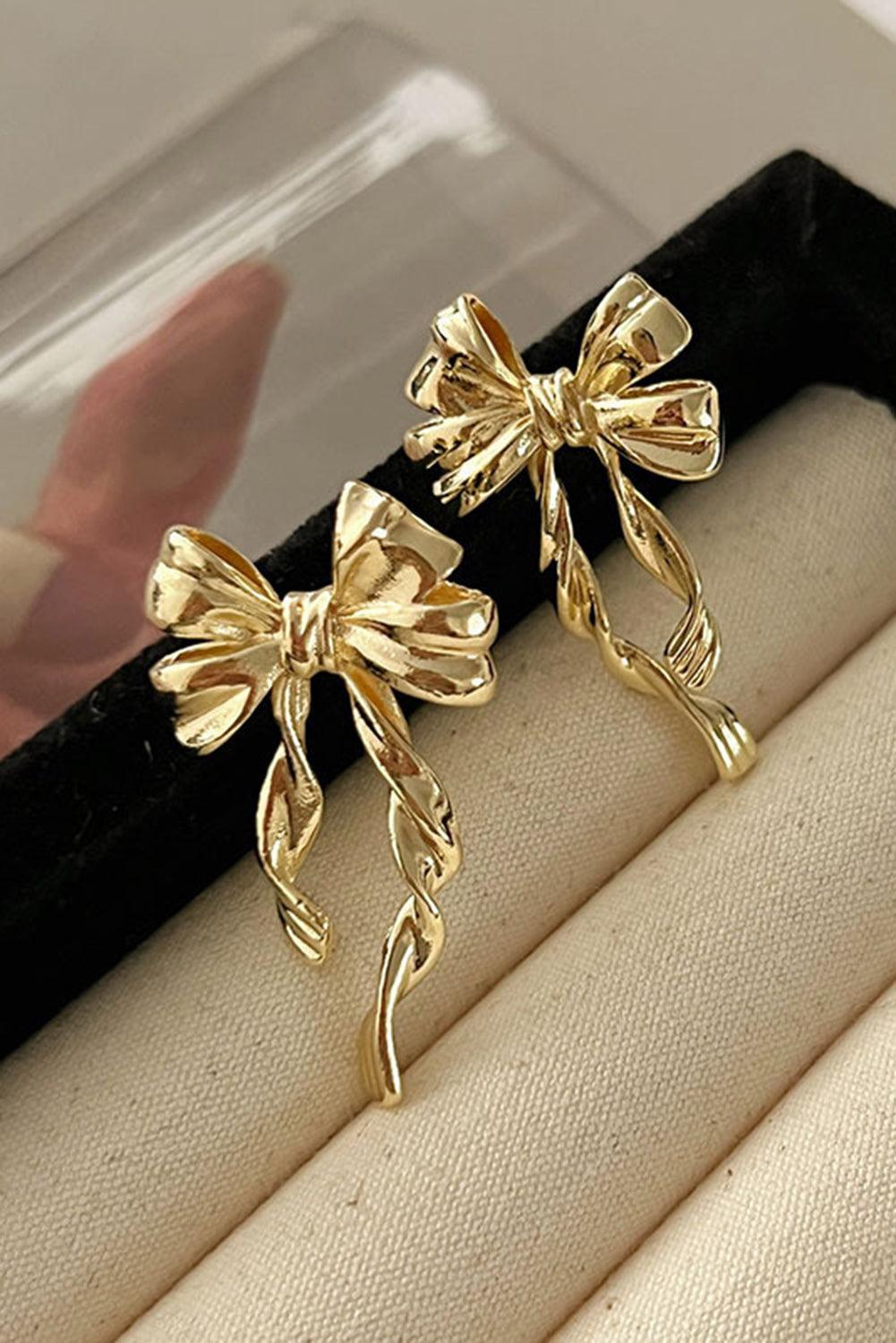 Gold bow knot earrings size comparison - lightweight design