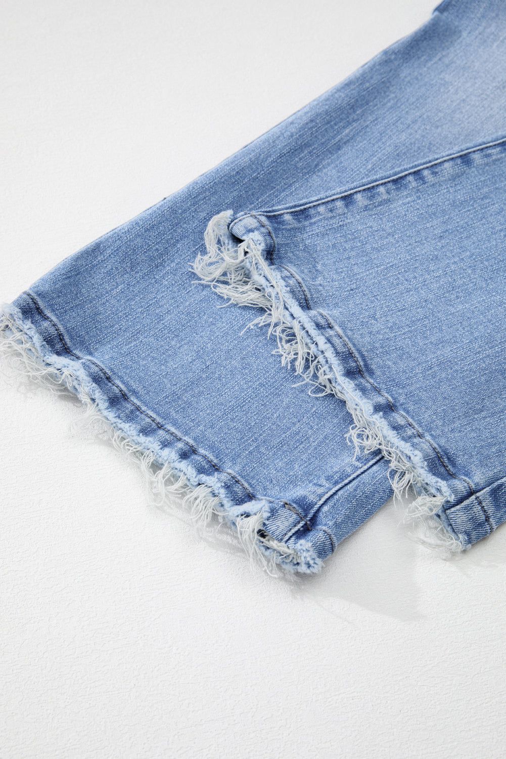 High waist flared denim featuring mineral wash and raw edge