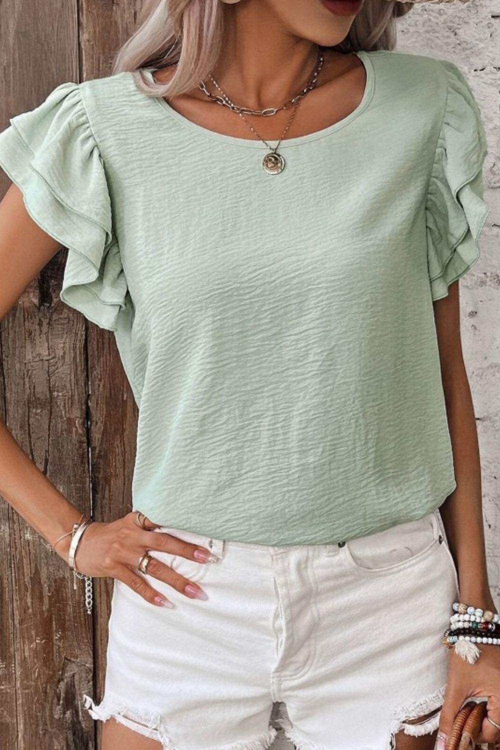 V-Neck Ruffled Cap Sleeve Blouse in light green with elegant ruffle details and classic v-neckline for versatile feminine style.