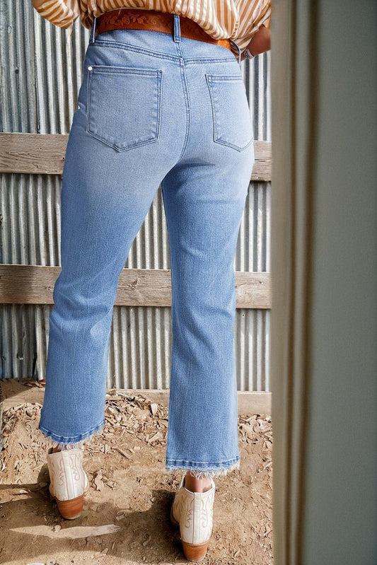 High waist flared jeans in beau blue mineral wash with raw hem