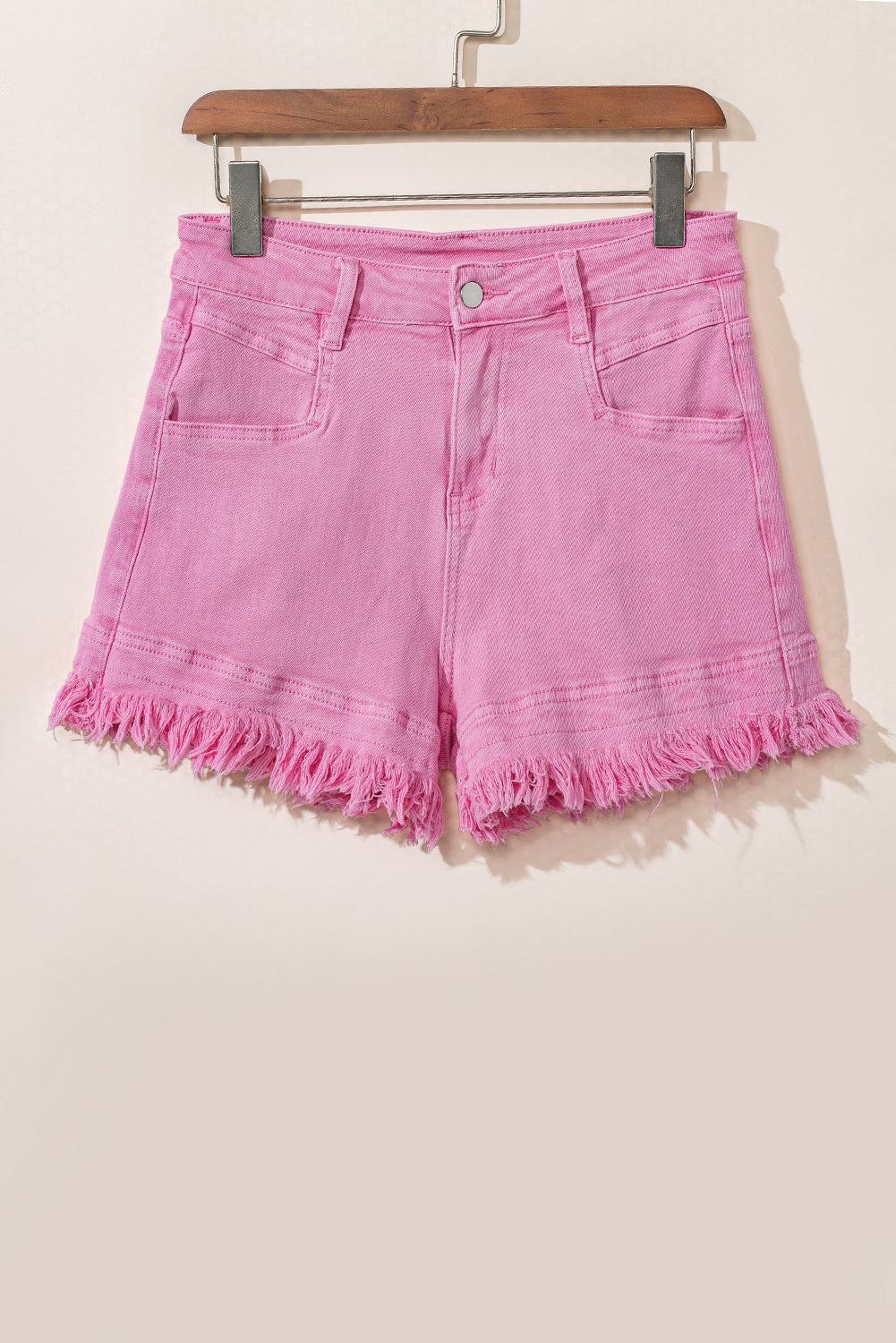 pink denim shorts on hanger