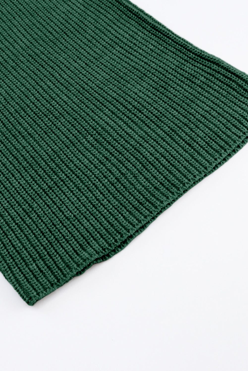 close view of the hem green knitwear set