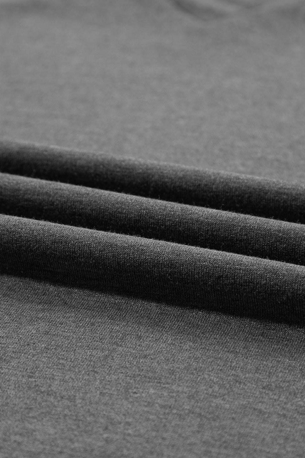 Carbon grey fabric close-up of breathable material for petal sleeve V neck T shirt