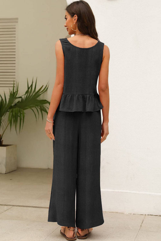 Black ribbed ruffle tank top and pants set, stylish two-piece outfit for women.