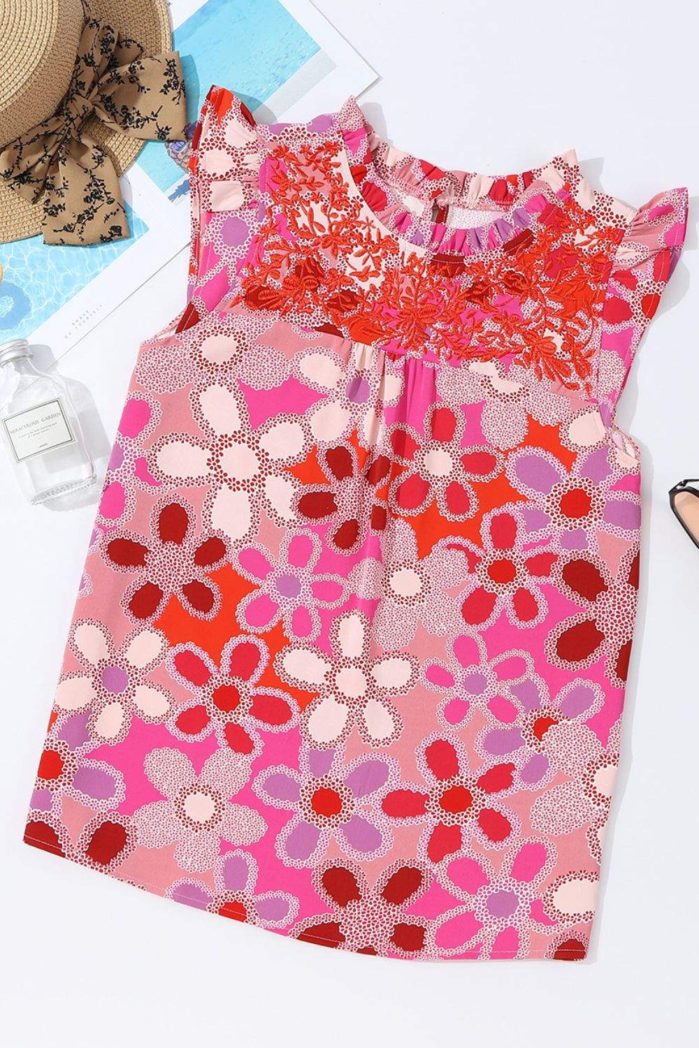 Floral Ruffled Cap Sleeve Blouse with Embroidered Detail in vibrant pink and red floral pattern.