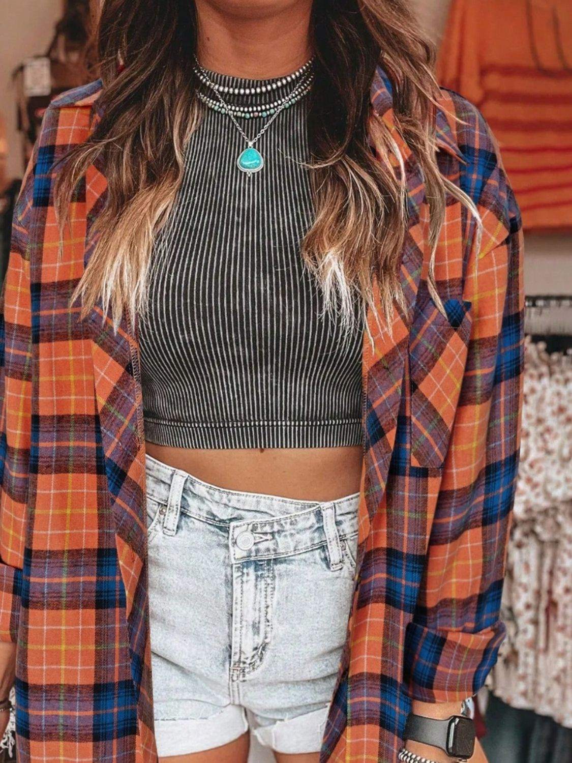 Plaid collared neck long sleeve shirt with pocket detail.