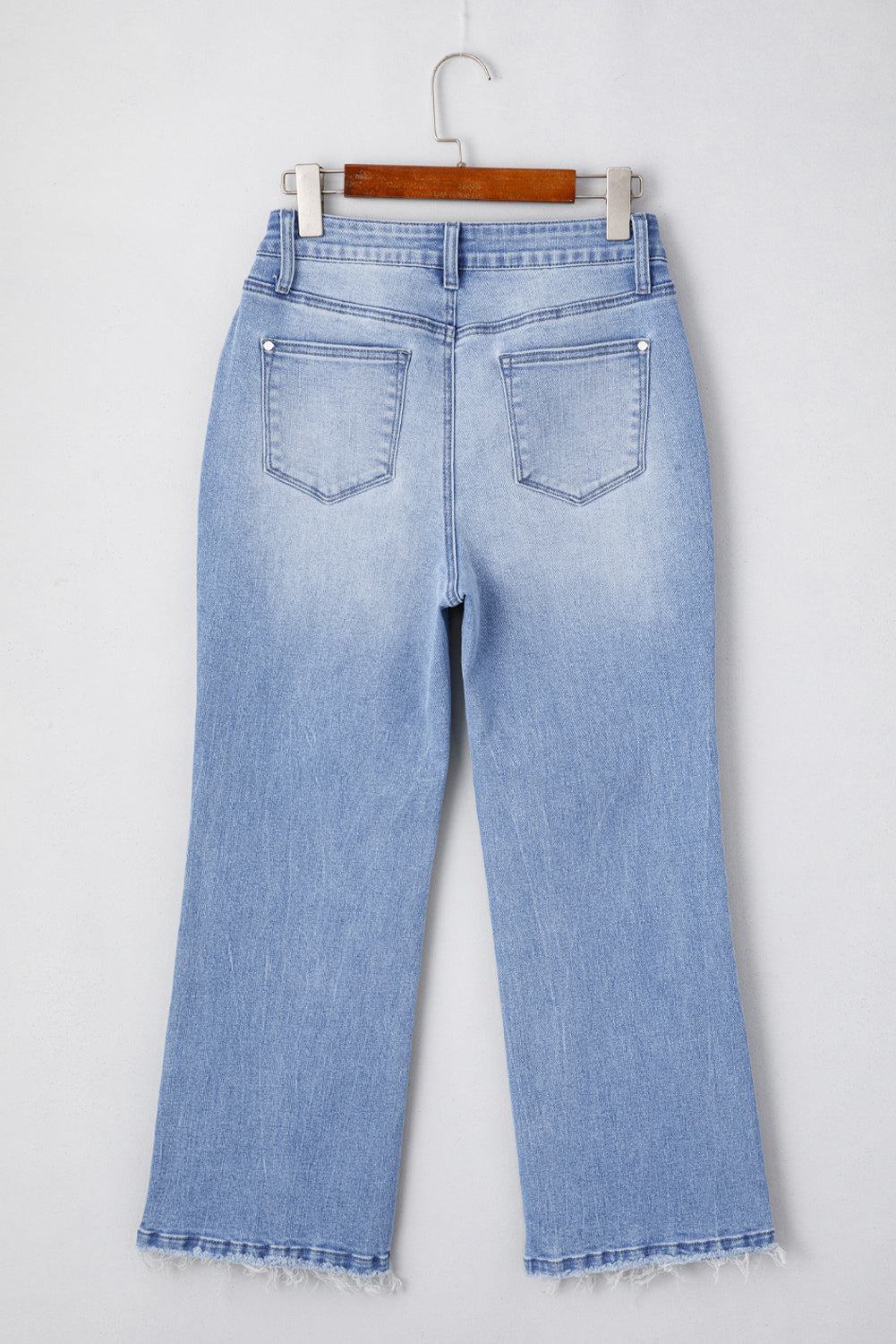 Beau Blue Mineral Wash high waist flared jeans with raw hem and trendy fit.