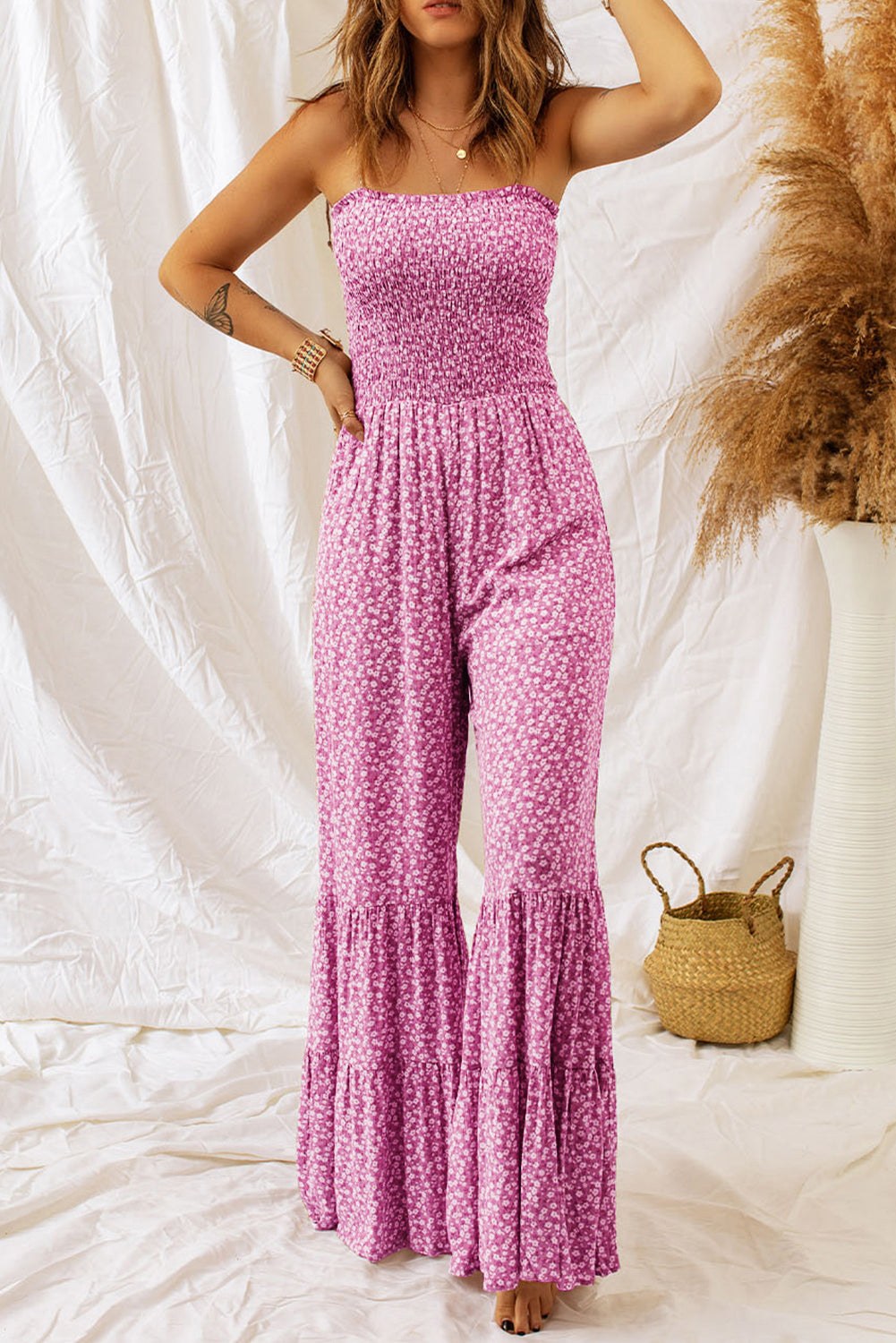 Phalaenopsis Floral Wide Leg Jumpsuit Women’s pink floral jumpsuit with smocked bodice, adjustable thin straps, and wide leg pants