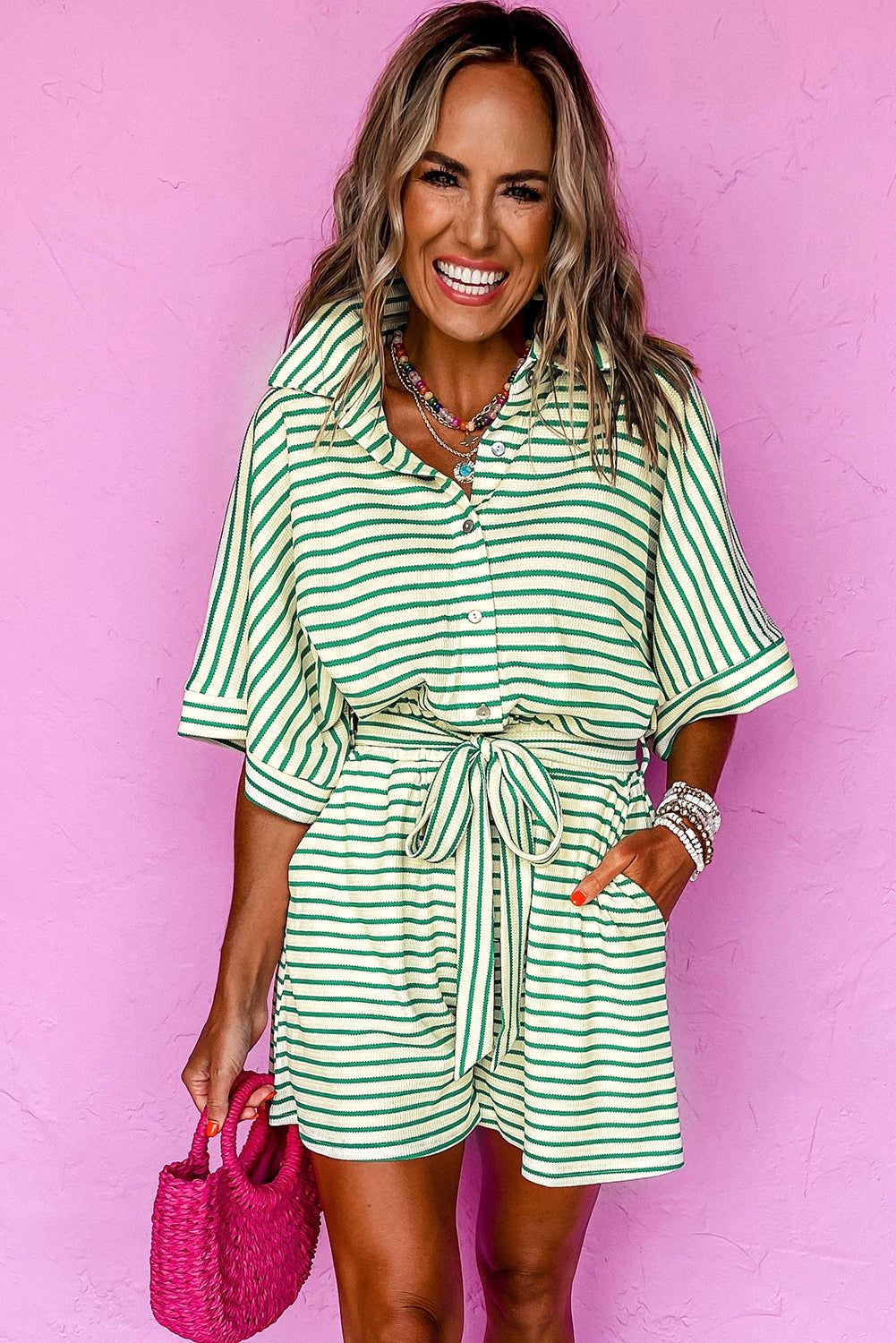 Green stripe textured short sleeve collared romper with waist tie.