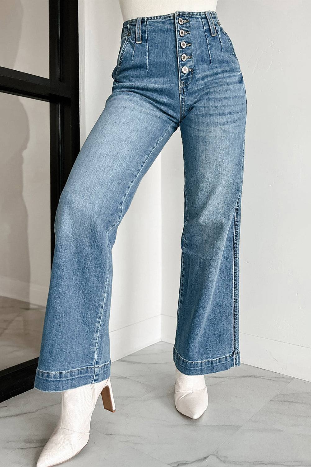 Dusk Blue Multi Buttons medium wash straight loose leg jeans with white boots.