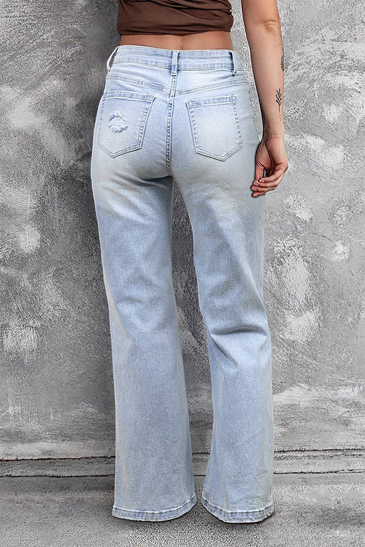 Rear view of Beau Blue Vintage Light Wash Distressed Flare Jeans with flare hem