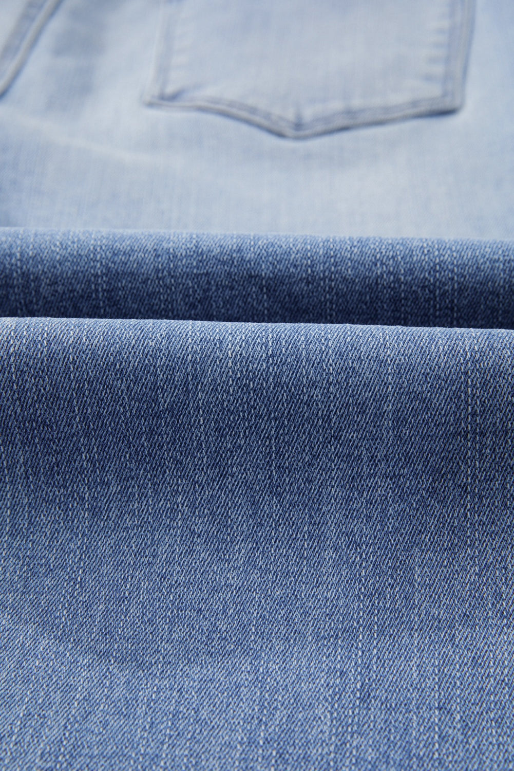 High waist flared jeans in mineral wash denim with raw hem detail