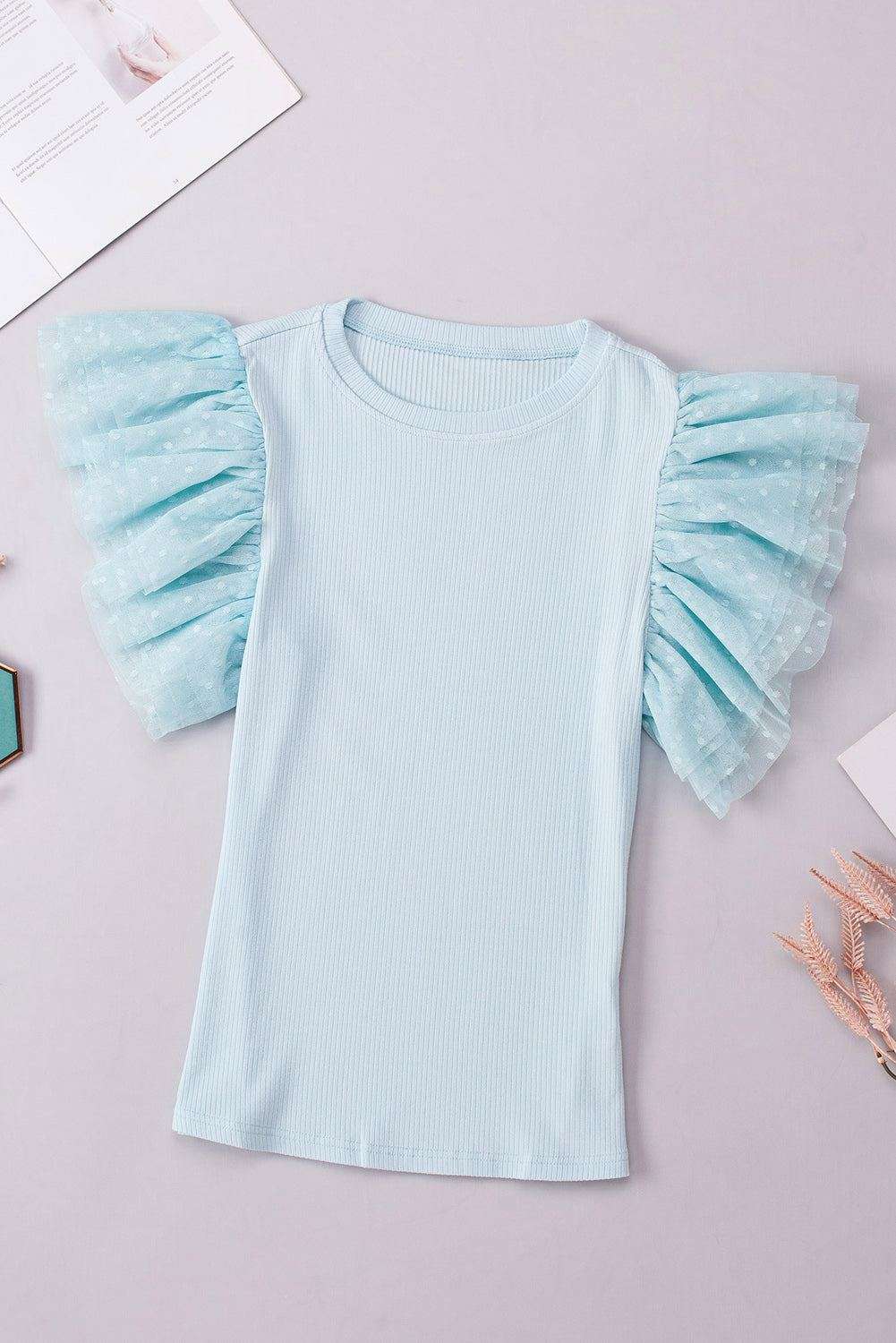 The Niche Store's feminine cap sleeve blouse with soft ruffles and versatile styling