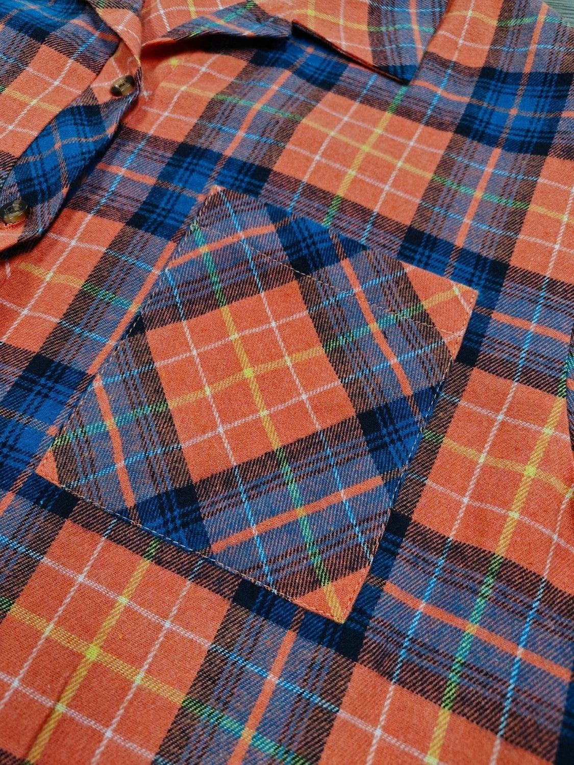 Plaid collared neck long sleeve shirt with pocket detail.