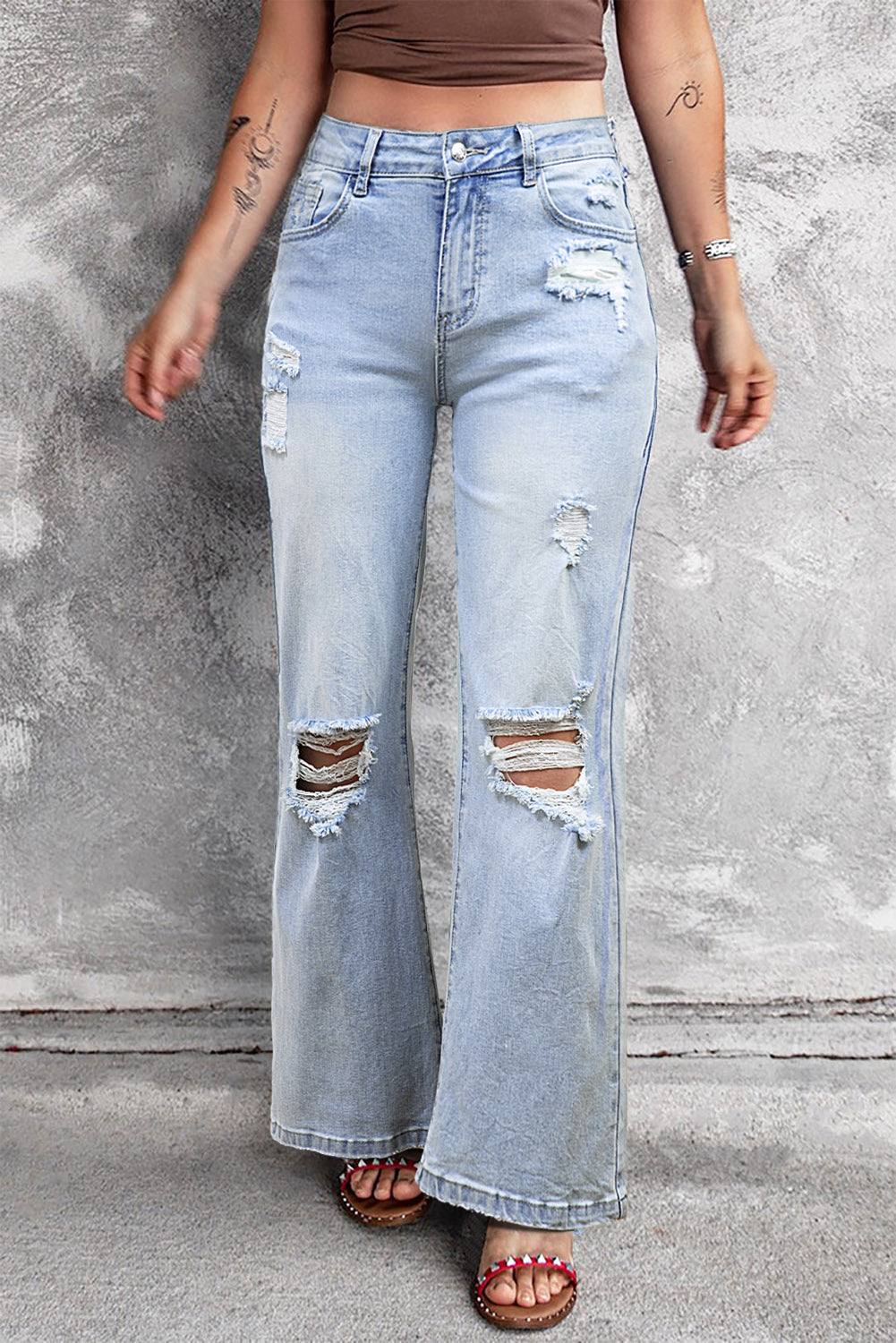 Model wearing Beau Blue Vintage Light Wash Distressed Flare Jeans full front view