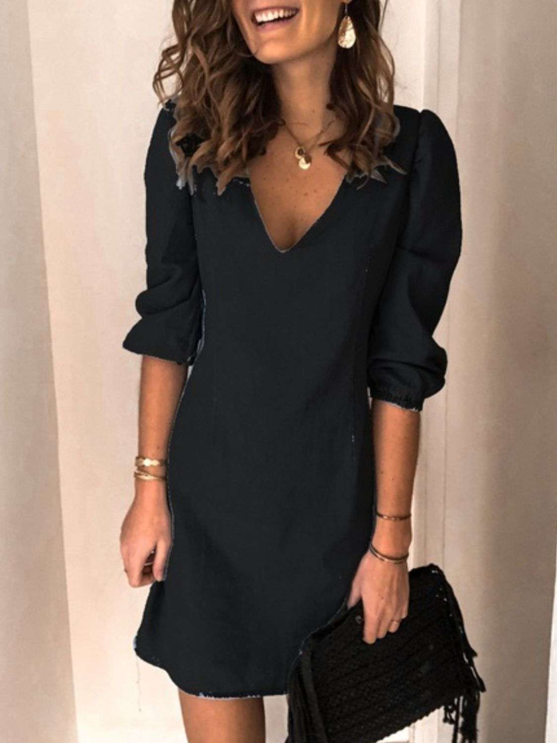 Full Size V-Neck Half Sleeve Dress in black without stretch, featuring machine-washable rayon-polyester blend.