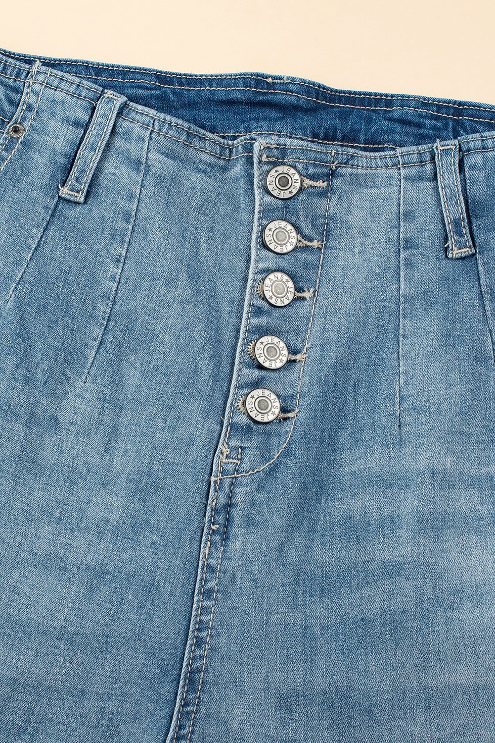 Dusk Blue Multi Buttons medium wash straight loose leg jeans with unique button closure.