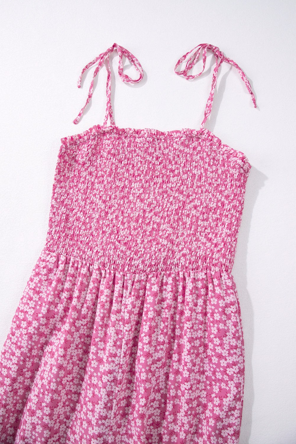 Pink floral Phalaenopsis smocked bodice jumpsuit with adjustable thin straps and wide leg pants