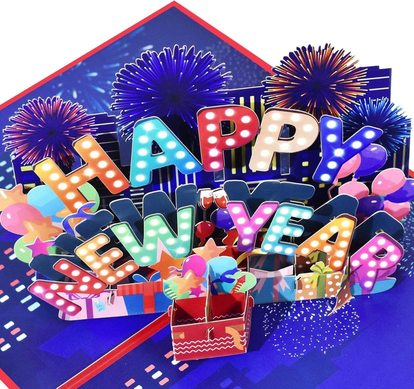 3D pop-up New Year card with fireworks scene and colorful decorations.