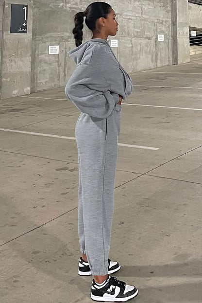 Right Side angle view of gray drop shoulder hoodie and jogger pants set