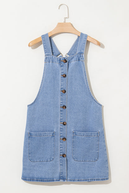 Robe courte en jean bleu à larges bretelles et poches boutonnées sur le devant