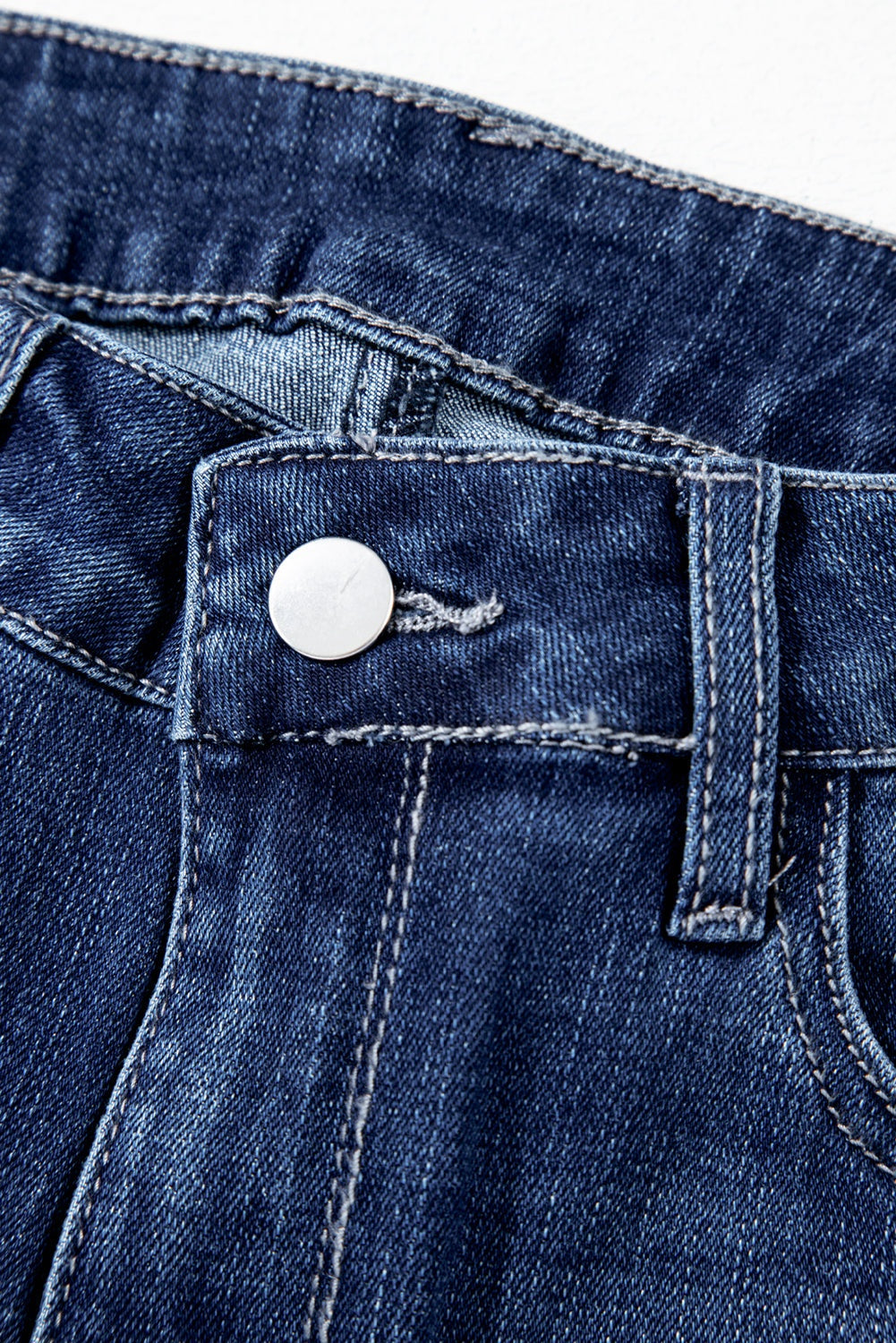Sail blue high waist jeans featuring mineral wash and raw edge hem