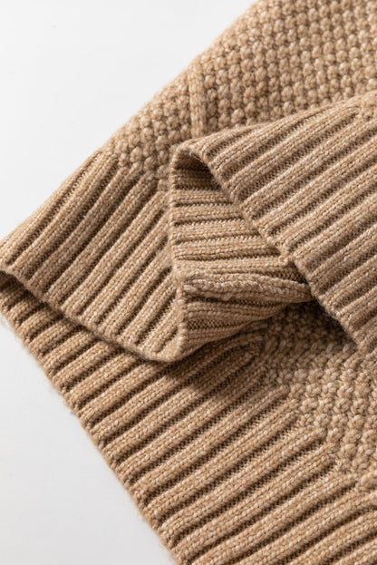 Parchment cable knit sweater dress fabric with intricate detailing and ribbed texture.