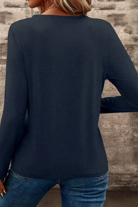 Back side of dirty blue V-neck t-shirt