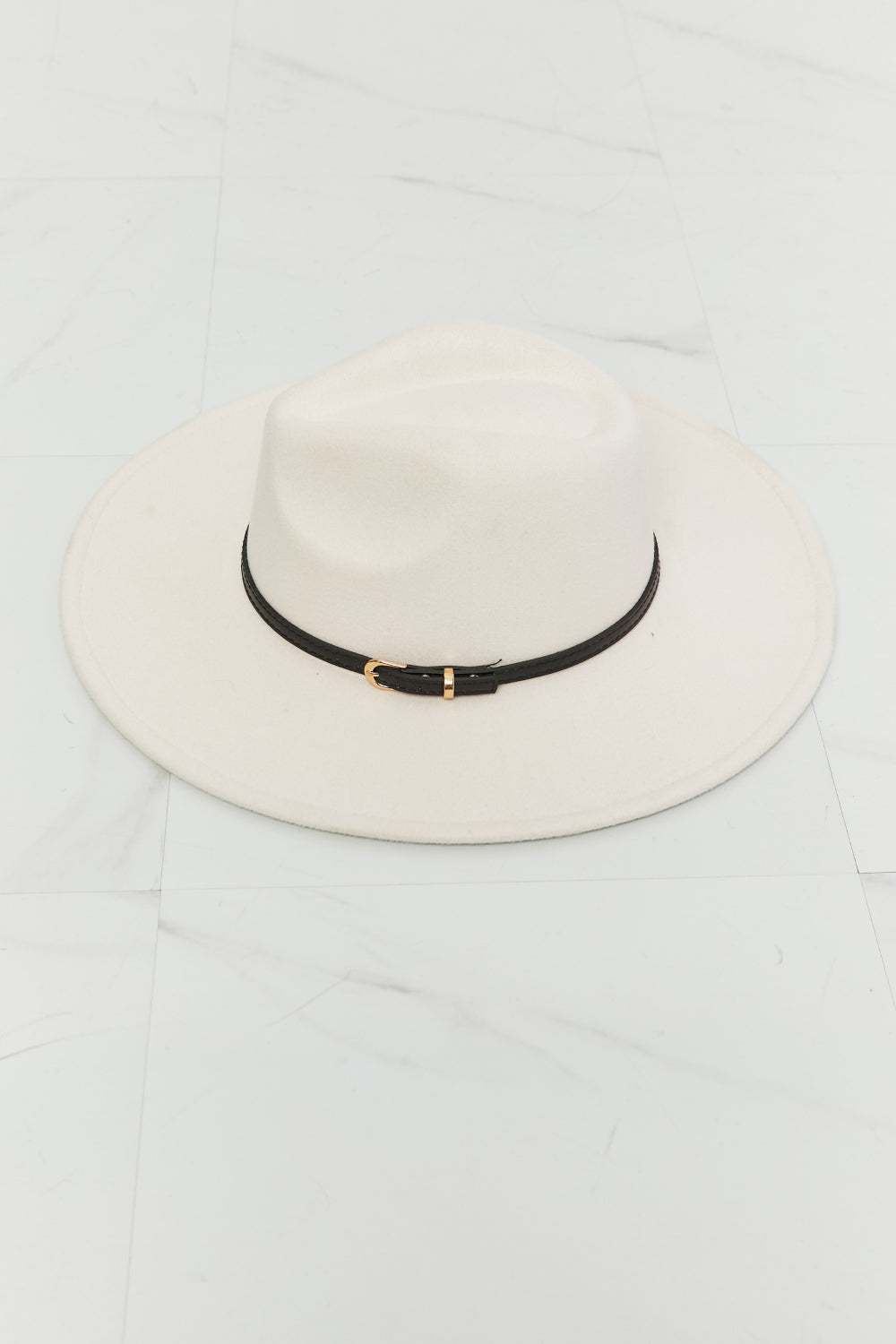 Women's beige wide brim fedora featuring black trim accent