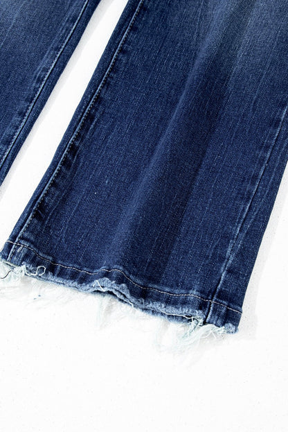 Sail blue high waist flared jeans with mineral wash finish and raw hem detail