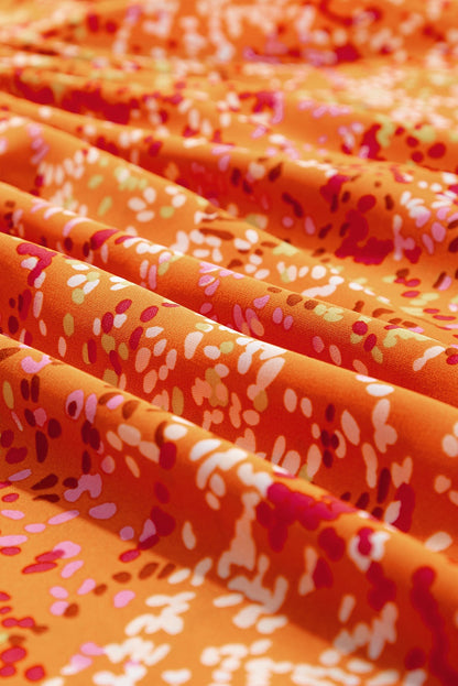 Close-up of orange babydoll blouse neckline