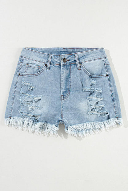 Light blue distressed high waist denim shorts with ripped details and raw hem.
