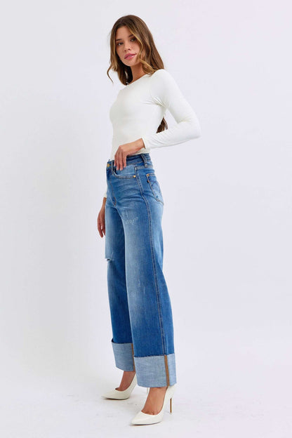 Judy Blue distressed high waist wide leg jeans styled with a white top and heels.