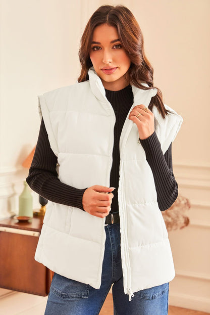 Woman wearing a Solid Zipper Stand Neck Oversized Puffer Vest in a stylish indoor setting.