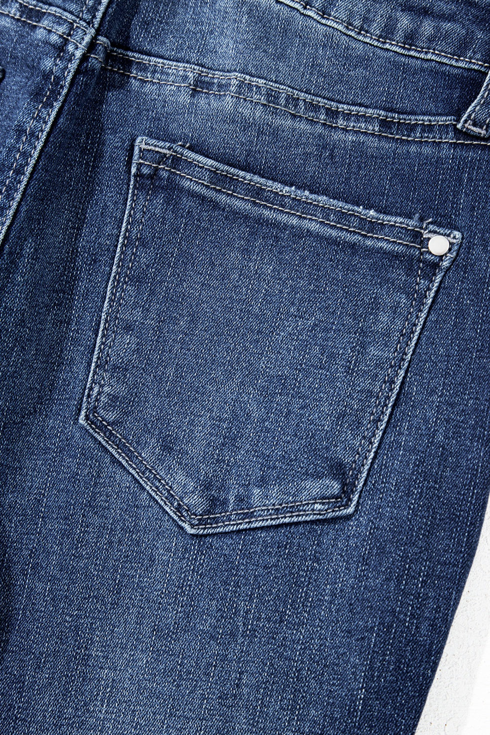 Sail blue denim jeans with high waist, flared silhouette and raw hem