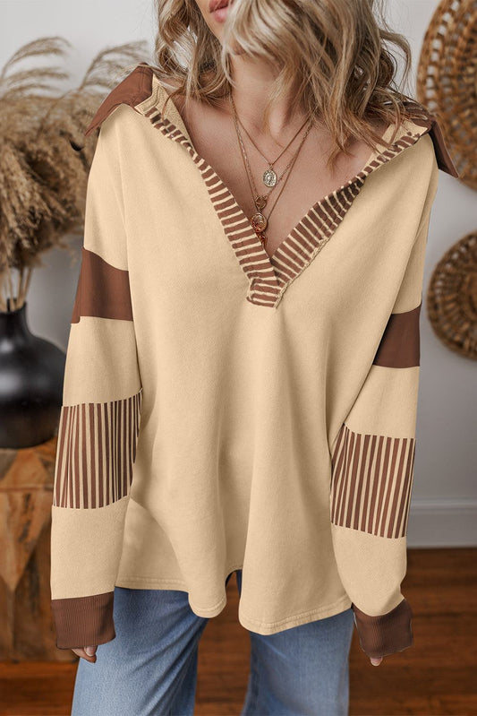 Light French Beige colorblock sweatshirt with striped patchwork and contrast collar on model wearing jeans