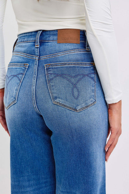 Judy Blue distressed high waist wide leg jeans showcasing back view with pocket detail.