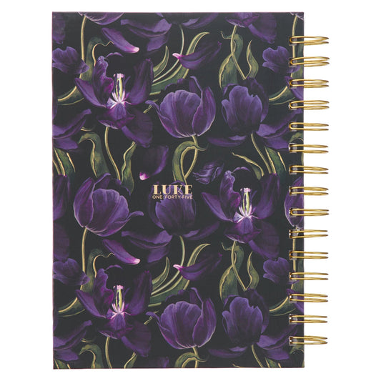Black and purple wirebound journal with floral design and Luke 1:45 Bible verse.