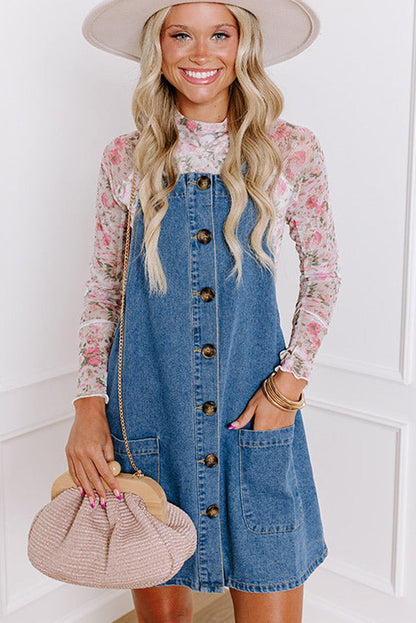 Dusk blue wide strap button front pocketed denim mini dress with floral inner top.