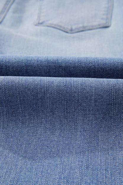 High waist flared jeans in mineral wash denim with raw hem detail
