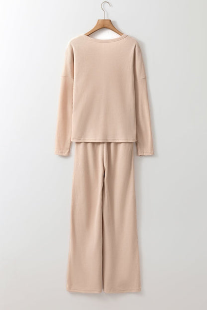 Beige Parchment Textured Lounge Set with relaxed top and tapered pants on hanger
