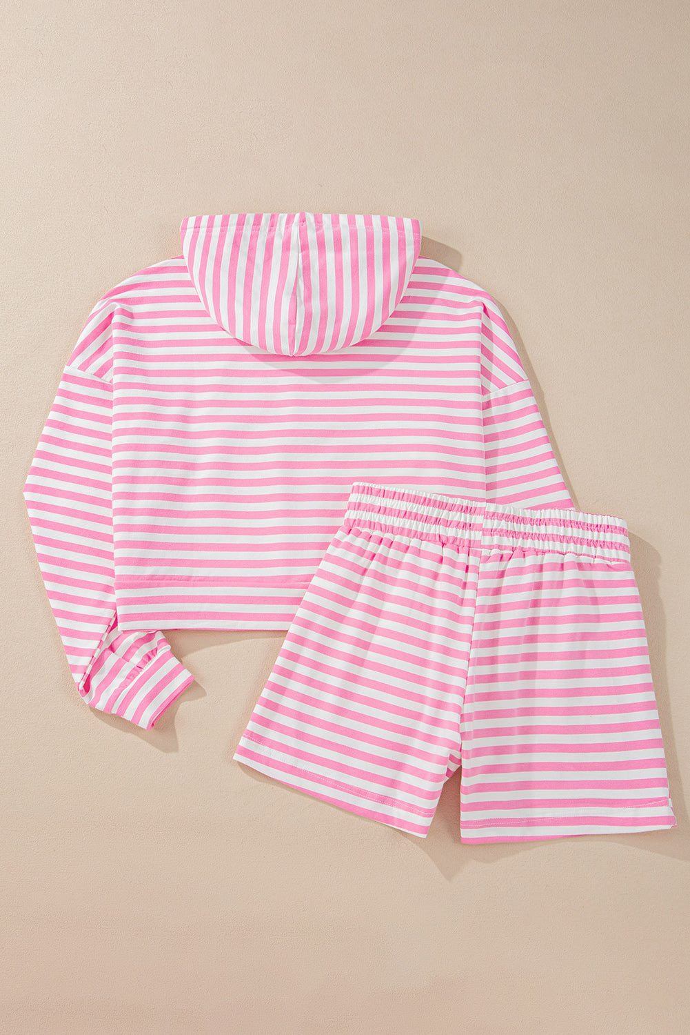 Pink stripe kangaroo pocket hoodie and wide leg shorts set displayed on neutral background.