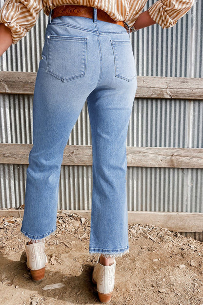 Beau Blue Mineral Wash Raw Hem High Waist Flared Jeans, showcasing trendy vintage style and flattering fit.