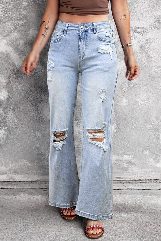 Model wearing Beau Blue Vintage Light Wash Distressed Flare Jeans full front view