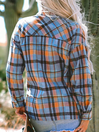 Plaid collared neck long sleeve shirt with blue and orange design.